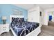 Bedroom with a queen bed and coastal decor at 8930 Sydney Ave, Kissimmee, FL 34747