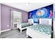 Bedroom with twin beds and Cinderella mural at 8930 Sydney Ave, Kissimmee, FL 34747