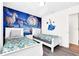 Bedroom with twin beds and Cinderella mural at 8930 Sydney Ave, Kissimmee, FL 34747