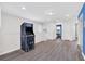 Game room with arcade game and wood-look flooring at 8930 Sydney Ave, Kissimmee, FL 34747