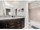Double vanity bathroom with granite countertop and shower at 8930 Sydney Ave, Kissimmee, FL 34747