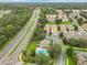 Aerial view of community, pool, and roads at 1382 Plumgrass Cir, Ocoee, FL 34761