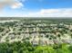 Aerial view of a residential neighborhood with lush greenery at 1382 Plumgrass Cir, Ocoee, FL 34761