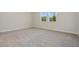 Bright bedroom with neutral wall paint and carpet at 487 Toscano St, Clermont, FL 34715
