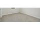 Spacious bedroom with neutral carpeting and bright natural light at 487 Toscano St, Clermont, FL 34715
