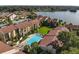 Community pool and lush landscaping near lake at 588 Orange Dr # 131, Altamonte Springs, FL 32701