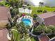 Community pool with surrounding landscaping at 588 Orange Dr # 131, Altamonte Springs, FL 32701