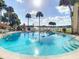 Relaxing circular pool with lake views and seating at 588 Orange Dr # 131, Altamonte Springs, FL 32701