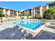 Inviting community pool with ample lounge chairs at 588 Orange Dr # 131, Altamonte Springs, FL 32701