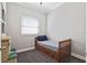 Bright bedroom with a twin bed, window blinds, and carpet flooring at 900 Sussex Close, Orlando, FL 32804