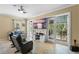 Living room with comfortable seating, large TV, and sliding glass doors to a balcony at 610 Celebration Ave # 1209, Celebration, FL 34747