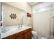 Bathroom with single sink vanity, shower/tub combo, and linen closet at 610 Celebration Ave # 1209, Celebration, FL 34747