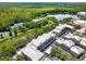 Aerial view showing community amenities such as tennis courts and a lake at 610 Celebration Ave # 1209, Celebration, FL 34747