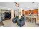 Living room with two leather recliners, and view into the kitchen at 610 Celebration Ave # 1209, Celebration, FL 34747