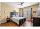 Bedroom with wood flooring, ceiling fan, and built-in wardrobe at 610 Celebration Ave # 1209, Celebration, FL 34747