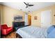Spacious bedroom with a comfy sitting area and large TV at 610 Celebration Ave # 1209, Celebration, FL 34747