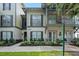 Exterior view of a two-story townhome with walkway and landscaping; no parking sign at 610 Celebration Ave # 1209, Celebration, FL 34747