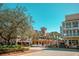 Quaint town square with shops and palm trees at 610 Celebration Ave # 1209, Celebration, FL 34747