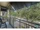 Private balcony overlooking a tree-lined street at 610 Celebration Ave # 1209, Celebration, FL 34747