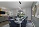 Formal dining room with seating for six, view of the pool at 1435 Moon Valley Dr, Davenport, FL 33896