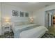 King bedroom with gray bedding, a dresser, and wall art at 1435 Moon Valley Dr, Davenport, FL 33896