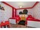 Mickey Mouse-themed bedroom with twin beds and playful decor at 1435 Moon Valley Dr, Davenport, FL 33896