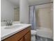 Clean bathroom with single vanity, bathtub, and shower at 1435 Moon Valley Dr, Davenport, FL 33896