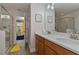 Bathroom with double vanity and a view into a ' bedroom at 1435 Moon Valley Dr, Davenport, FL 33896