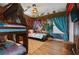 Moana themed bedroom with full-size bed and bunk beds at 1435 Moon Valley Dr, Davenport, FL 33896