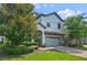 Two-story home with gray siding and brick driveway at 1435 Moon Valley Dr, Davenport, FL 33896