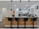 Modern kitchen island with seating for four at 1435 Moon Valley Dr, Davenport, FL 33896