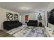 Finished basement with two sofas and large TV at 1435 Moon Valley Dr, Davenport, FL 33896