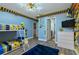 Minions-themed bedroom with bunk beds, TV, and ample closet space at 1435 Moon Valley Dr, Davenport, FL 33896