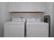 Laundry room with washer, dryer, and overhead cabinets at 1435 Moon Valley Dr, Davenport, FL 33896