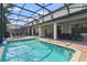 Resort-style screened pool with plenty of space for relaxation at 1435 Moon Valley Dr, Davenport, FL 33896