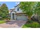Two-story home with gray siding and brick driveway at 1435 Moon Valley Dr, Davenport, FL 33896