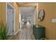 Modern entryway with wood wall and green cabinet at 1435 Moon Valley Dr, Davenport, FL 33896
