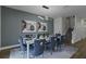 Bright dining room with table and chairs near the stairs at 1435 Moon Valley Dr, Davenport, FL 33896