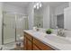 Double vanity bathroom with shower and modern fixtures at 1435 Moon Valley Dr, Davenport, FL 33896
