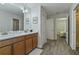 Double vanity bathroom with a large mirror and plenty of storage at 1435 Moon Valley Dr, Davenport, FL 33896