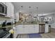 Modern kitchen with granite countertops and stainless steel appliances at 1435 Moon Valley Dr, Davenport, FL 33896