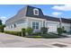 Gray house with white garage door and landscaping at 900 Sussex Close, Orlando, FL 32804