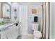 Simple bathroom with double vanity, granite countertop and shower at 900 Sussex Close, Orlando, FL 32804
