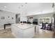 Open concept kitchen with a large island and view into living area at 900 Sussex Close, Orlando, FL 32804