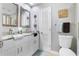 Clean bathroom with double vanity, granite countertop, and toilet at 900 Sussex Close, Orlando, FL 32804
