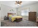 Relaxing Primary bedroom with wood dresser and ceiling fan at 900 Sussex Close, Orlando, FL 32804