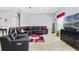 Relaxing living room featuring leather furniture and a large TV at 900 Sussex Close, Orlando, FL 32804