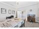 Primary bedroom with a queen-size bed, home office, and carpet flooring at 900 Sussex Close, Orlando, FL 32804