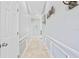 Bright hallway with tile flooring and wainscoting at 900 Sussex Close, Orlando, FL 32804
