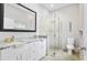 Elegant bathroom with double vanity, large mirror, and a walk-in shower at 900 Sussex Close, Orlando, FL 32804